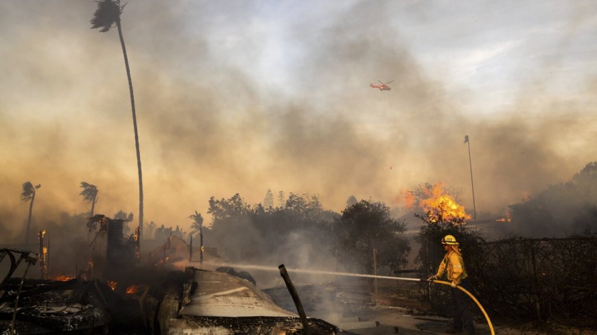 Firefighters advance on destructive blaze in California, aided by slower winds