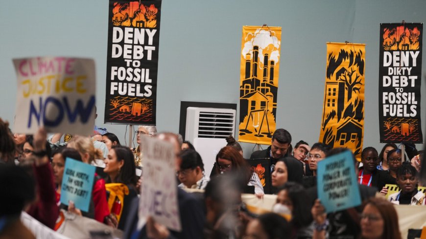 Protesters gather at UN climate talks in global day of action as progress on a deal slows