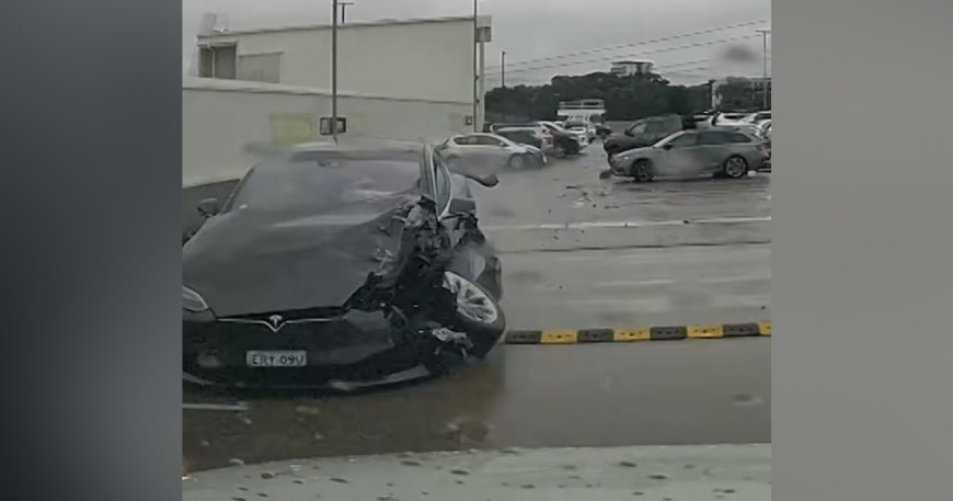 Out-of-control Tesla crashes into cars, plunges off carpark roof