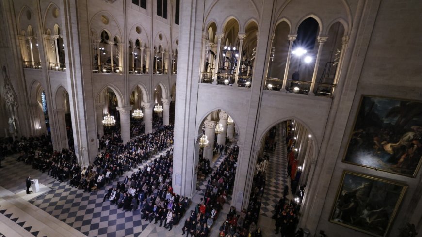 An archbishop's knock formally restores Notre Dame to life as winds howl and heads of state look on