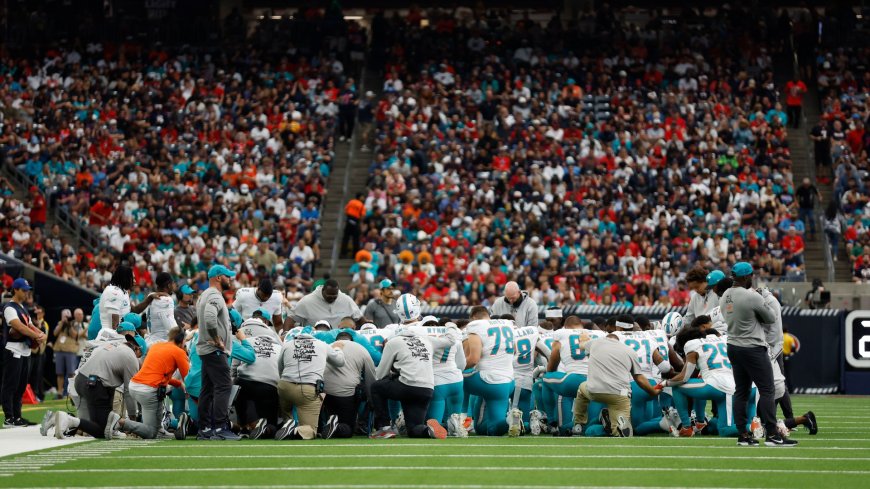 ‘It was scary’ – NFL stars pray on field as Miami Dolphins wide receiver taken to hospital after gruesome hit