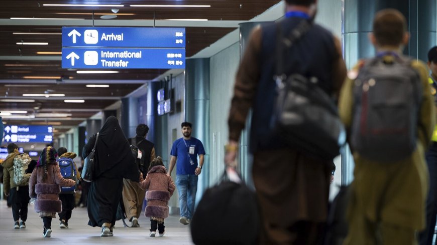 Afghans arrive in the Philippines to complete visa processing for resettlement in US